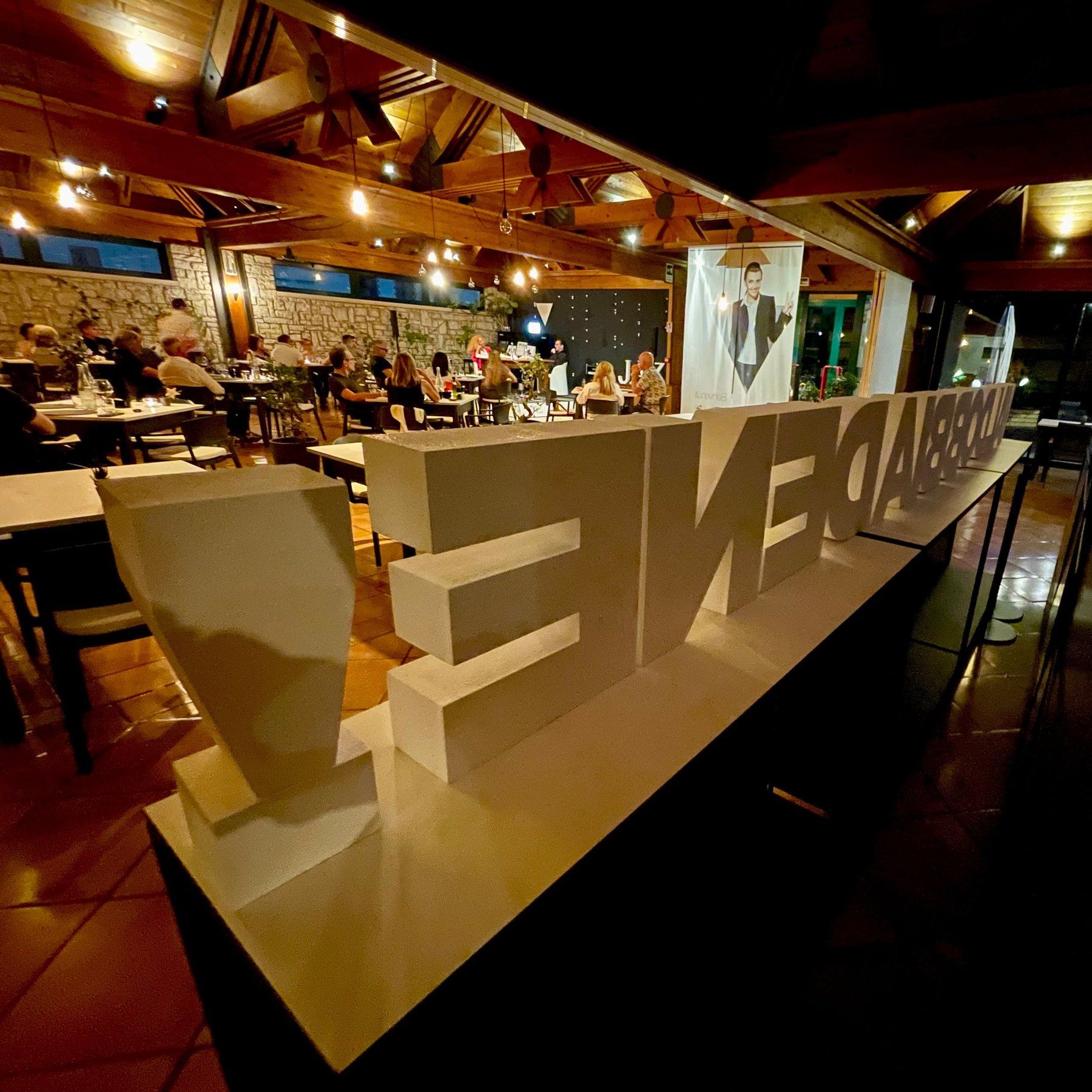 The Ristorante V dining room with the illuminated Valdobbiadene sign